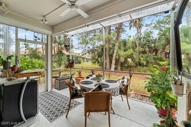 sunroom featuring ceiling fan