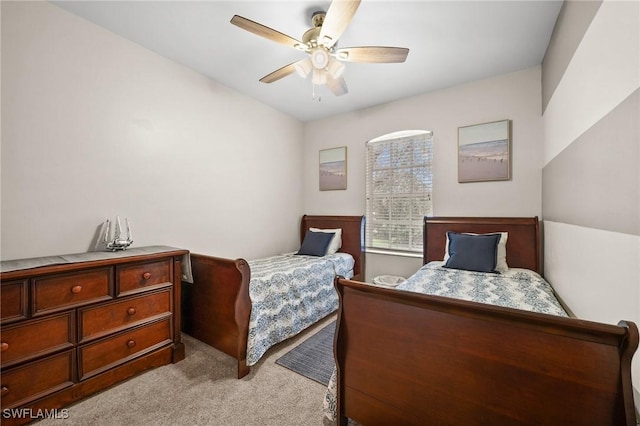 bedroom featuring ceiling fan and light carpet