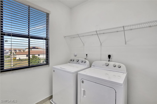 washroom featuring washing machine and dryer