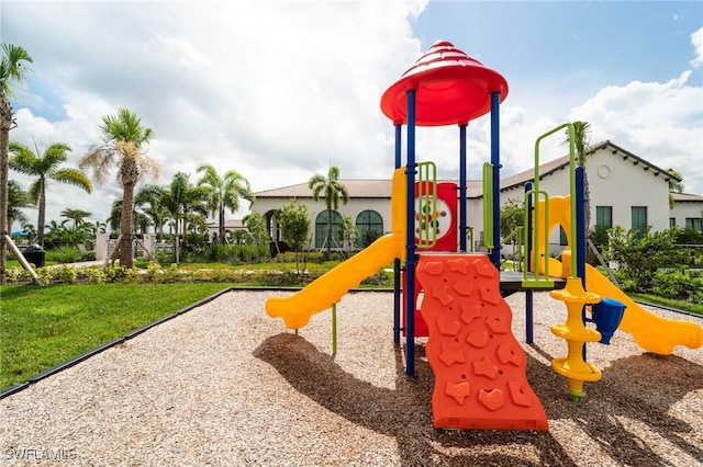 view of playground with a lawn