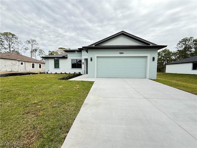 view of front facade with a garage and a front yard