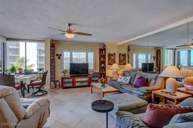 living room featuring crown molding, a wealth of natural light, and light tile patterned flooring