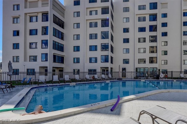 view of swimming pool with a patio area