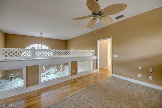 unfurnished living room featuring light wood-type flooring and ceiling fan