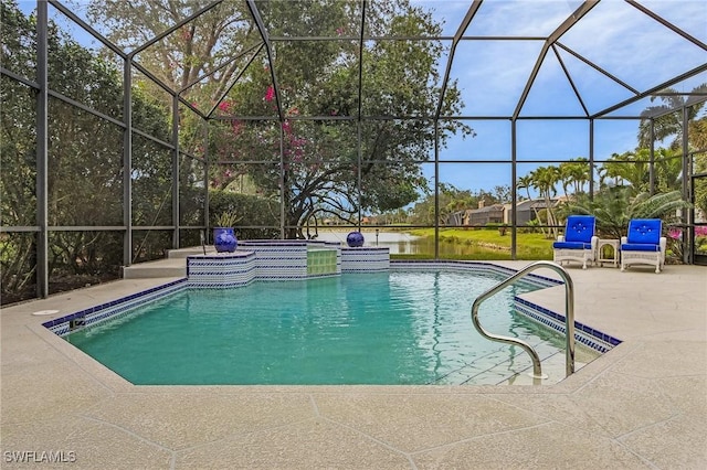 view of pool with a patio area and glass enclosure