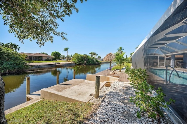 dock area featuring a lanai and a water view