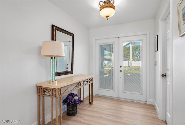 doorway to outside with light wood-type flooring and french doors