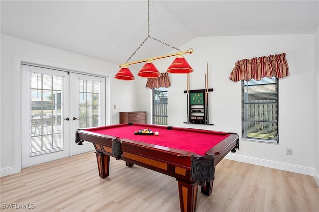 rec room with french doors, hardwood / wood-style flooring, pool table, and vaulted ceiling