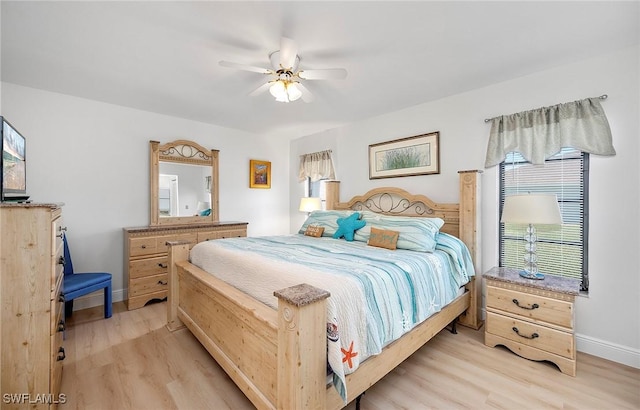 bedroom with ceiling fan and light wood-type flooring