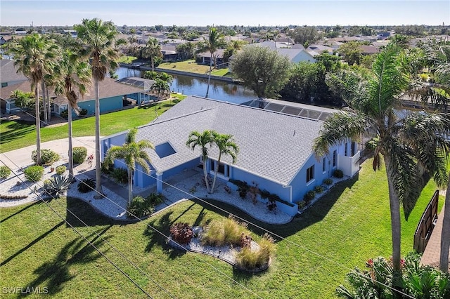 drone / aerial view with a water view