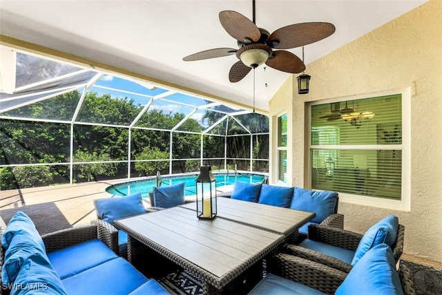 view of patio / terrace featuring ceiling fan, a lanai, and outdoor lounge area