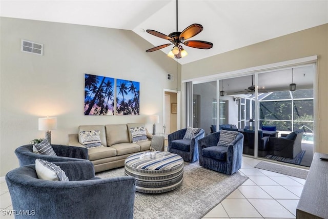 tiled living room with lofted ceiling and ceiling fan