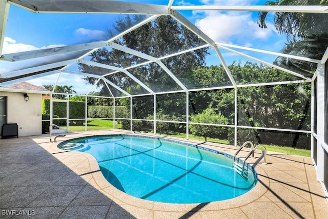 view of pool featuring a lanai and a patio