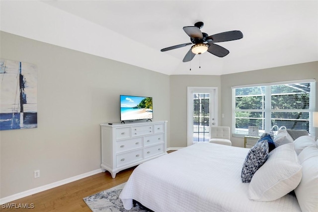 bedroom with ceiling fan and light hardwood / wood-style flooring