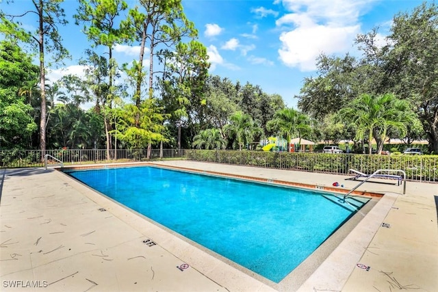 view of swimming pool with a patio area