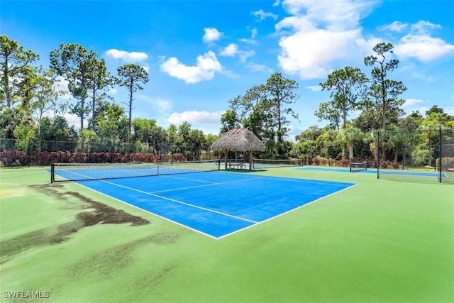 view of tennis court with basketball court