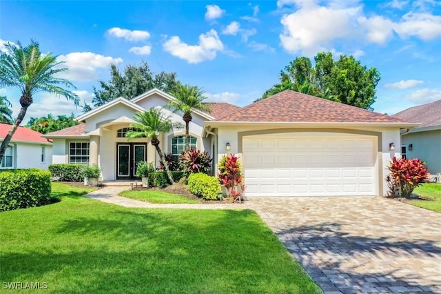 single story home with a front yard and a garage