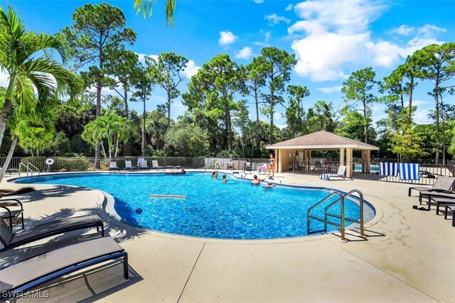 view of pool featuring a gazebo and a patio