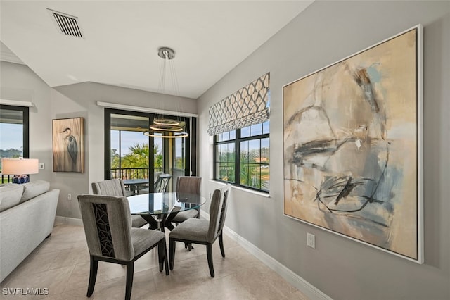 dining area featuring a notable chandelier