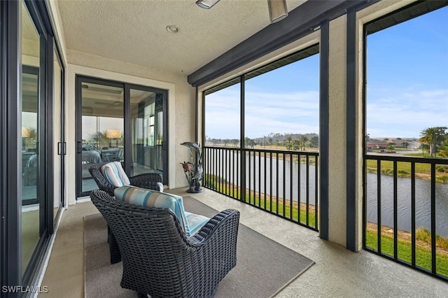 sunroom with a water view