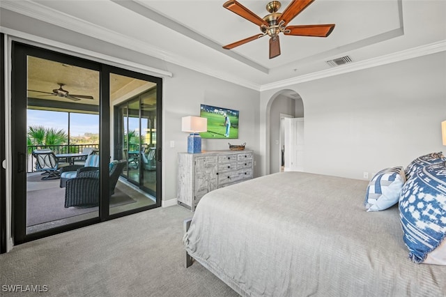 carpeted bedroom with access to outside, ornamental molding, a raised ceiling, and ceiling fan