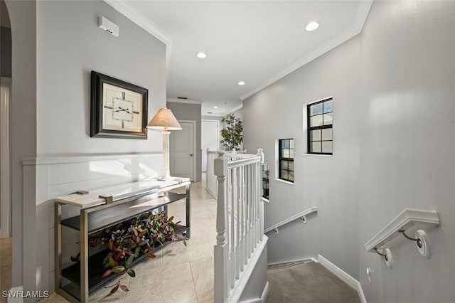 stairway featuring ornamental molding and tile patterned floors