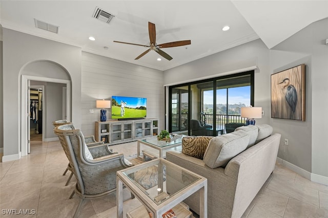 tiled living room featuring ceiling fan