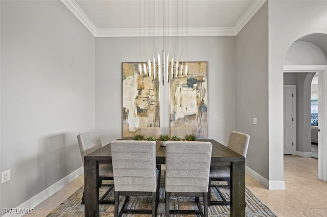 tiled dining space with ornamental molding and a notable chandelier