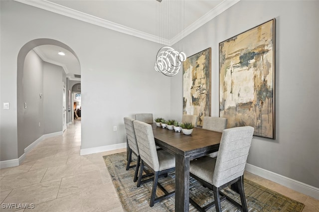 dining room with an inviting chandelier and crown molding