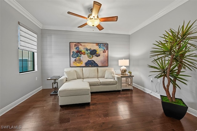 living room with dark wood-type flooring, ceiling fan, and crown molding