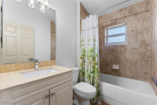 full bathroom with a textured wall, vanity, toilet, and shower / tub combo with curtain