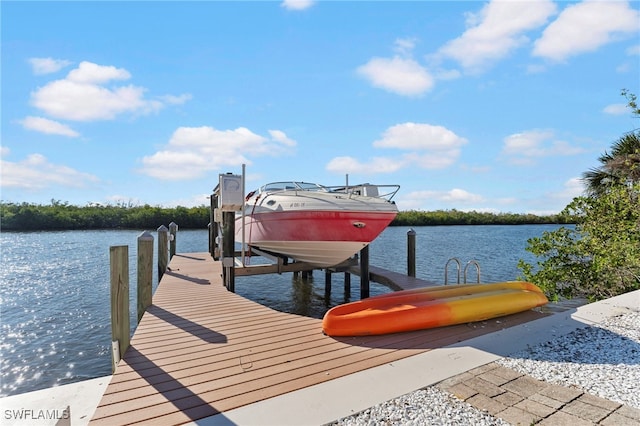 dock area with a water view and boat lift