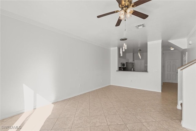 unfurnished living room with ceiling fan, crown molding, and light tile patterned floors