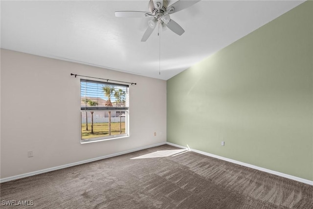 unfurnished room featuring ceiling fan and carpet flooring