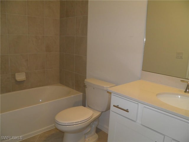 full bathroom featuring toilet, vanity, tile patterned floors, and tiled shower / bath