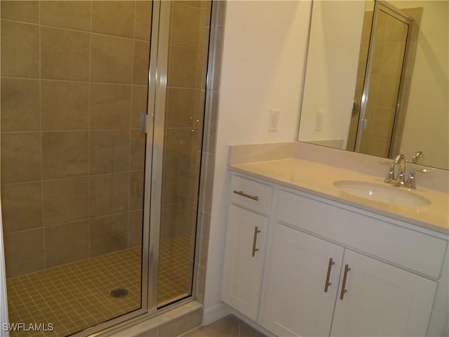 bathroom with vanity and an enclosed shower