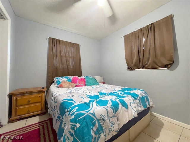 bedroom with light tile patterned flooring and ceiling fan