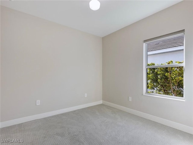 carpeted empty room with a wealth of natural light