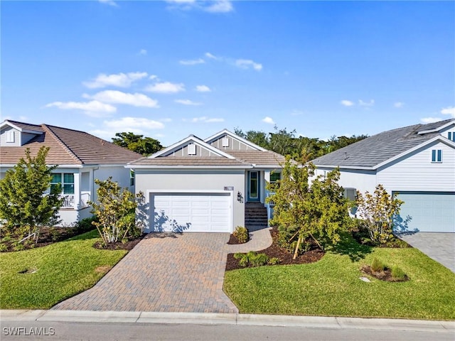 view of front of property featuring a garage and a front yard