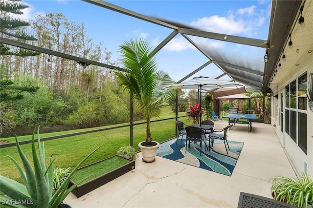 view of patio with a lanai