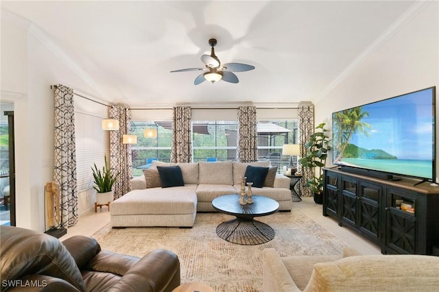 living room featuring crown molding and ceiling fan