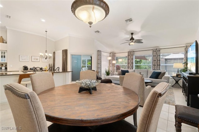 dining room featuring crown molding, ceiling fan with notable chandelier, and light tile patterned floors