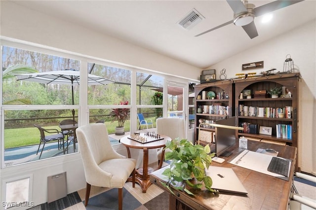 office area featuring ceiling fan, lofted ceiling, and a wealth of natural light