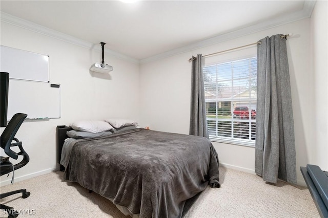 bedroom featuring ornamental molding and light colored carpet