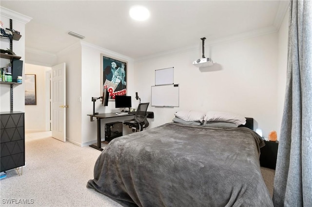 bedroom with ornamental molding and light colored carpet