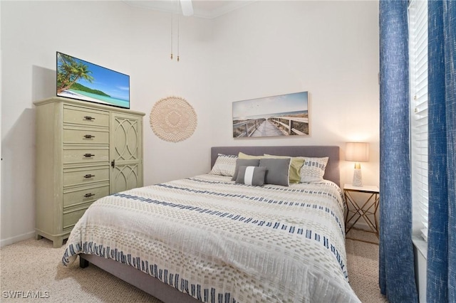 bedroom featuring light carpet and ceiling fan