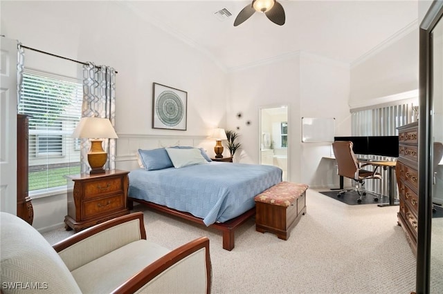 carpeted bedroom featuring multiple windows, built in desk, ornamental molding, and ceiling fan