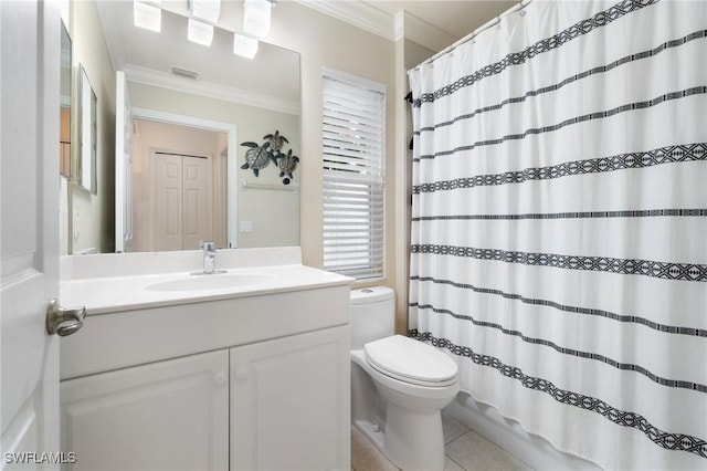 bathroom with vanity, crown molding, tile patterned floors, and toilet