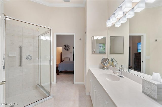 bathroom with vanity, crown molding, a shower with shower door, and tile patterned floors