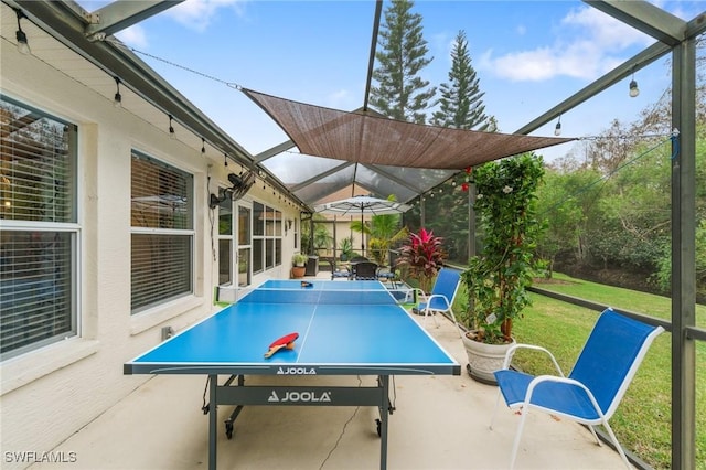 view of patio / terrace featuring glass enclosure